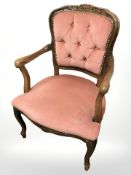 Two continental walnut framed salon armchairs.