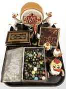 A pair of cast iron terrier book ends, two tins, one tin containing marbles, Brio wind up toy,