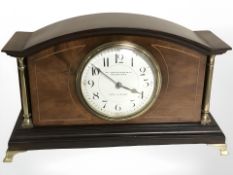 An inlaid mahogany eight day mantle clock retailed by William Drummond and Co Melbourne,