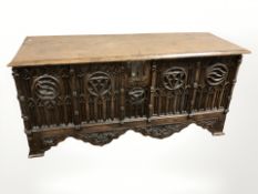 A 19th century gothic revival carved oak coffer, 146 cm x 51 cm x 70 cm.