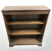 A Newplan stained oak open bookcase,