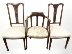 A pair of inlaid mahogany salon chairs and a further armchair.