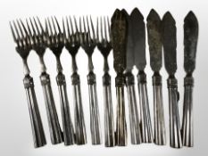 A set of twelve continental silver knives and forks CONDITION REPORT: 421.