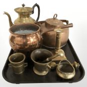 Brass and copper wares including tea pots, cooking pot, candlestick, pestle and mortars, etc.