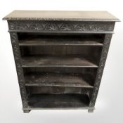 A 19th century carved and ebonised open bookcase,