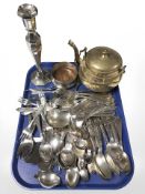 A quantity of loose stainless steel cutlery, silver plated candlestick,