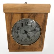A continental burr walnut cased wall clock with silvered dial, height 48 cm.
