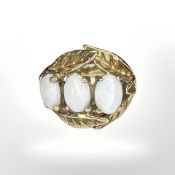 A 9ct yellow gold ring set with three white opals, size O. CONDITION REPORT: 6.3g.