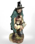 A Royal Doulton figure 'The Mask Seller' HN2103.