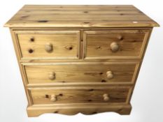 A modern pine four drawer chest, 91 cm x 45 cm x 85 cm.