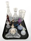 A group of perfume bottles, atomiser, Waterford crystal mantel time piece,