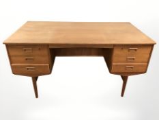 A 20th century Danish teak twin pedestal writing desk, 145 cm x 73 cm x 73 cm.