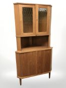 A 20th century Danish teak corner cabinet.