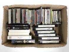 A quantity of CDs, cassettes and VHS tapes.