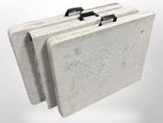 Three folding trestle tables