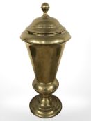 A brass lidded urn, height 57 cm.