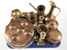 A pair of brass candlesticks, pestal and mortar, copper plated cooking pan,