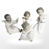 Four Lladro boy angels.