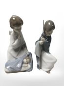 Two Lladro figures of boys, No. 4635 and No. 4672.