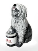 A Royal Doulton Dulux dog, height 14 cm.