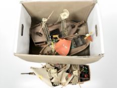 Three plastic model boats.