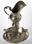 A continental silver jug, smaller pair of lidded jugs,
