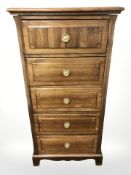 A 20th century walnut five drawer tallboy, 67 cm x 39 cm x 129 cm.
