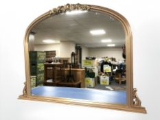A contemporary gilt over mantle mirror in the Victorian style, 125 cm x 92 cm.