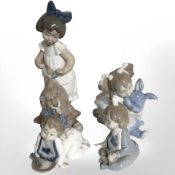 Four Nao figures of young girls.