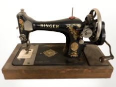 An antique Singer hand sewing machine.
