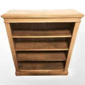 A walnut open bookcase, 89 cm x 29 cm x 102 cm.