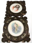 A pair of colour lithographs depicting Christ and the Madonna in carved and painted wooden frames,