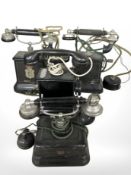 Four antique Continental telephones,