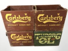 Three painted pine Carlsberg crates and a Tuborg crate,