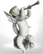 A Lladro figure of a cherub with trumpet.