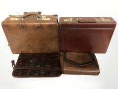 A group of leather brief cases,
