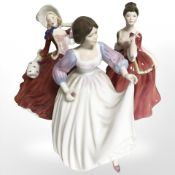 Three Royal Doulton figures 'Autumn Breezes' HN1934, 'Flower of Love' HN3970 and 'Ashley' HN3420.