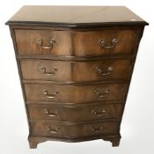 A reproduction mahogany serpentine front five drawer chest, 74 cm x 44 cm x 104 cm.