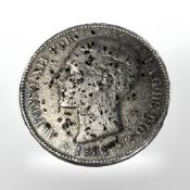 A 19th century five pesetas coin.