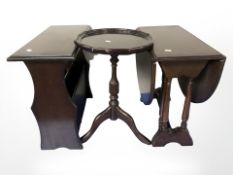 A reproduction mahogany drop leaf table, tripod table and magazine stand.
