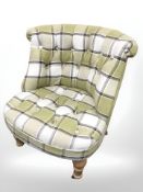 A contemporary ladies chair in buttoned checkered fabric.