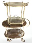 Two brass framed drinks trolleys, largest 82 cm long.