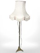 A brass standard lamp with shade, height 182 cm.