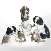 Three Nao figures of dogs.