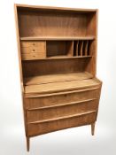 A 20th century Danish teak open bookcase, fitted three drawers beneath, 84 cm x 44 cm x 147 cm.