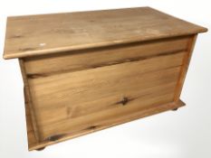 A modern pine blanket box, 111 cm x 66 cm x 66 cm.