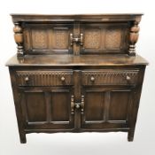 An Ercol stained elm sideboard,