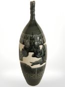 A 20th century Chinese olive glazed earthenware vase depicting fish with four character mark to