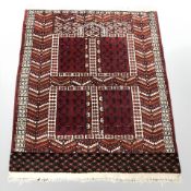 A Turkoman rug, Afghanistan, 114 cm x 92 cm.
