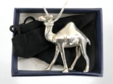 A cast silver figure of a camel, height 5 cm. CONDITION REPORT: 65g.